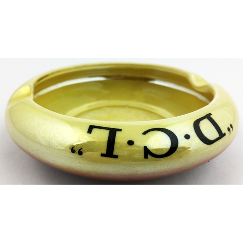 127 - D. C. L ASHTRAY. 4.25ins diam. Lustre glaze effect - yellow to dark peach. Black transfer all round.... 