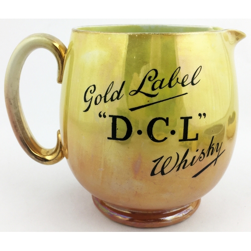 128 - D. C. L WHISKY JUG. 5ins tall. Lustre glaze effect - yellow to light peach, gold rim & handle. Black... 