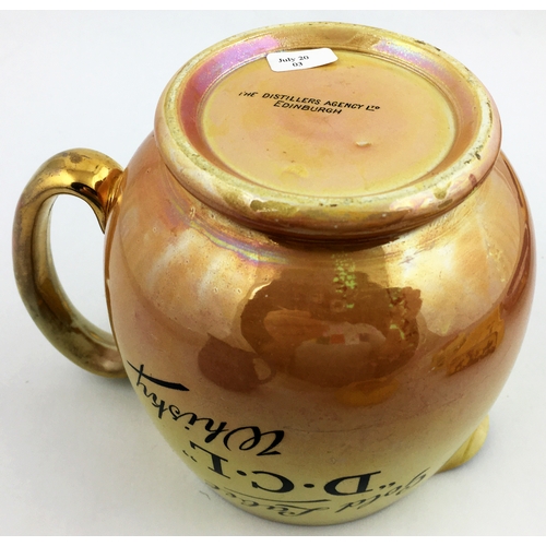 128 - D. C. L WHISKY JUG. 5ins tall. Lustre glaze effect - yellow to light peach, gold rim & handle. Black... 