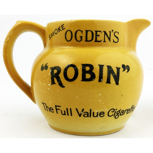 139 - OGDENS REDBREAST FLAKE PUB JUG. 4ins tall. Yellowy-mustard body, white interior. Black transfer each... 