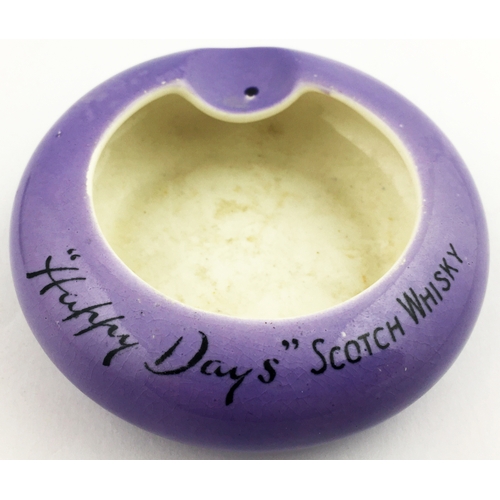 163 - HAPPY DAYS SCOTCH WHISKY ASHTRAY. 3.5 ins diam. Striking purple coloured glaze to outside of bowl wi... 