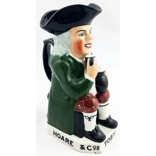 179 - HOARE & COS TOBY  ALE & STOUT ADVERTISING JUG. 9ins tall. Hoare & Co seated gent toby, c.1930. Round... 