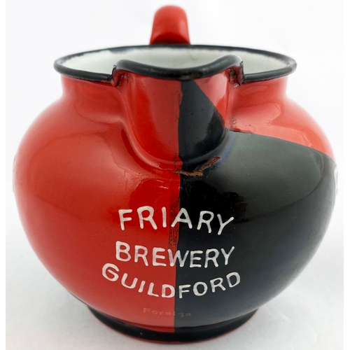 234 - GUILDFORD FRIARY ALE ENAMELLED BAR TOP JUG. Diagonal design - half black & half deep red, white insi... 