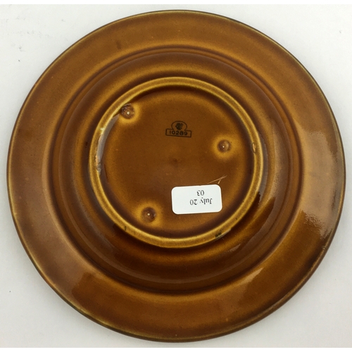 258 - EMPIRE NUT BROWN TOBACCO ASHTRAY. 5.1ins diam. Large jovial pipe smoker to centre, lettering to rim ... 