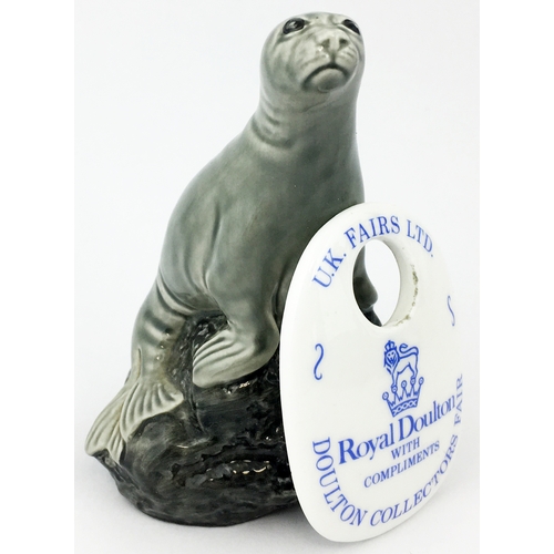 273 - BENEAGLES SEAL SHAPED WHISKY DECANTER. 4ins tall, well sculpted - and still full? Plus 2.6ins tall. ... 