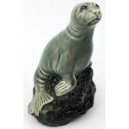 273 - BENEAGLES SEAL SHAPED WHISKY DECANTER. 4ins tall, well sculpted - and still full? Plus 2.6ins tall. ... 