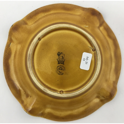 290 - GAELIC OLD SMUGGLER WHISKY ASHTRAY. 5.3ins diam. Sandy pverall glaze colour with black transfer to o... 