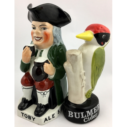 300 - HOARE & CO TOBY JUG & BULMERS CIDER STATUETTE. Tallest 8.9ins. Multi-coloured duo: rotund beer seate... 