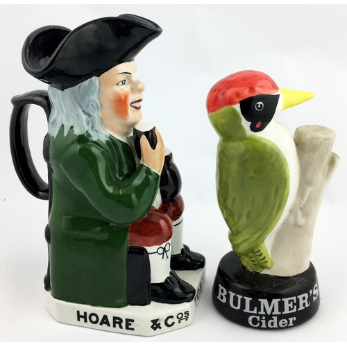 300 - HOARE & CO TOBY JUG & BULMERS CIDER STATUETTE. Tallest 8.9ins. Multi-coloured duo: rotund beer seate... 