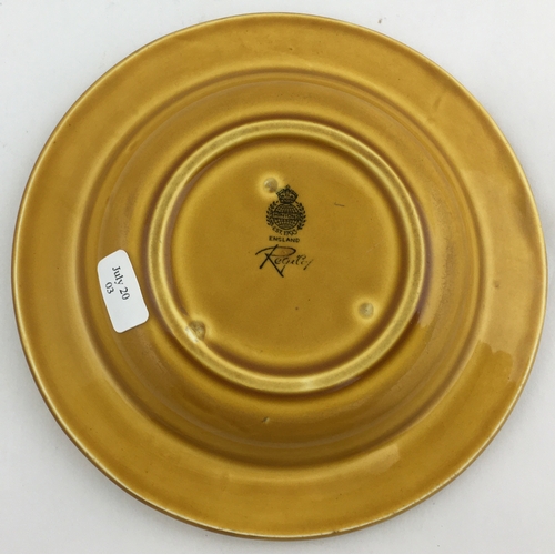 64 - TRUMANS ASHTRAY. 5.1ins diam. Caramel colour, black words round edge and eagle t.m. to centre. Minto... 