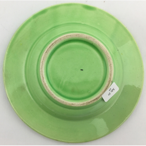 65 - TRUMANS ASHTRAY. 5.3ins diam. Pale green colour variant, raised lettering around perimeter, eagle t.... 