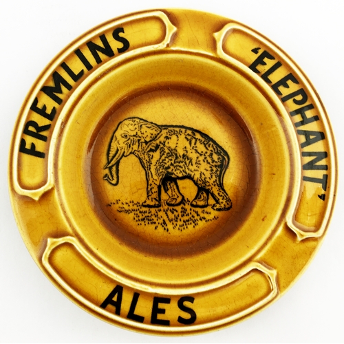 68 - FREMLINS ELEPHANT ALES ASHTRAY. 5.4ins diam Caramel coloured dish, black wording, elephant pict. t.m... 