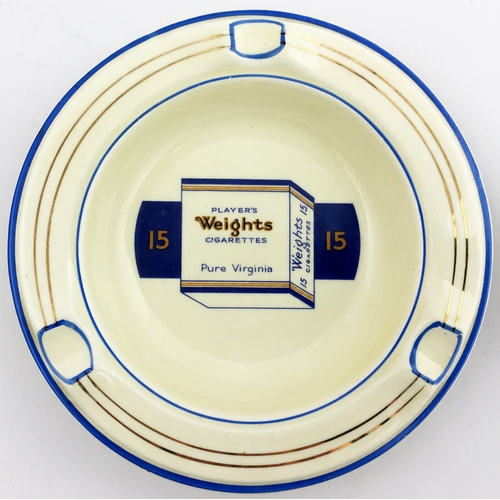 73 - PLAYERS WEIGHTS CIGARETTES CERAMIC ASHTRAY. 4.8 ins diam.  Circular with gold & blue detailing, & la... 