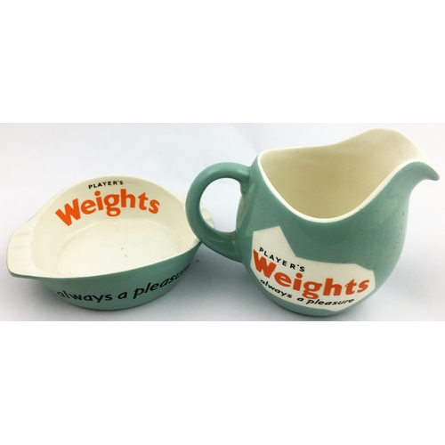 76 - PLAYERS WEIGHTS WATER JUG & ASHTRAY. 4.5 in tall jug & 5.8 diam. ashtray. Mint-green body glaze, bla... 