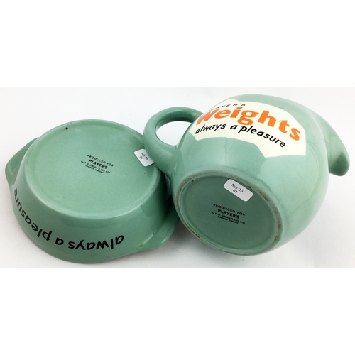 76 - PLAYERS WEIGHTS WATER JUG & ASHTRAY. 4.5 in tall jug & 5.8 diam. ashtray. Mint-green body glaze, bla... 