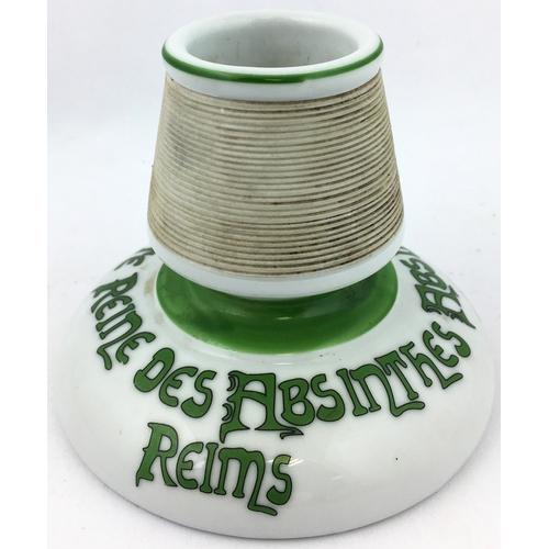 79 - ABSINTHE REINETTE REIMS ASHTRAY. 4.6ins diam, 3.7ins tall. Porcelaineous bright white pottery featur... 