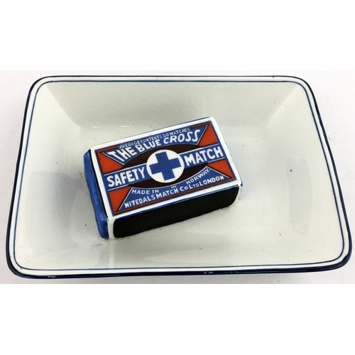 84 - BLUE CROSS SAFETY MATCH ASHTRAY. 5.2 x 3.8ins all white pottery with 3D coloured matchbox to centre,... 