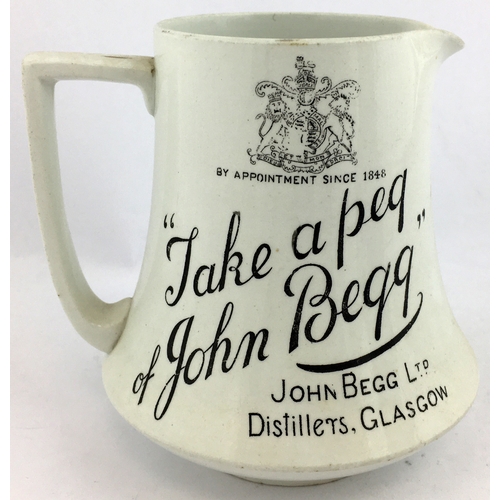 90 - JOHN BEGG LTD DISTILLERS GLASGOW WHISKY WATER JUG. 5.1ins tall. Black design both sides - coat of ar... 