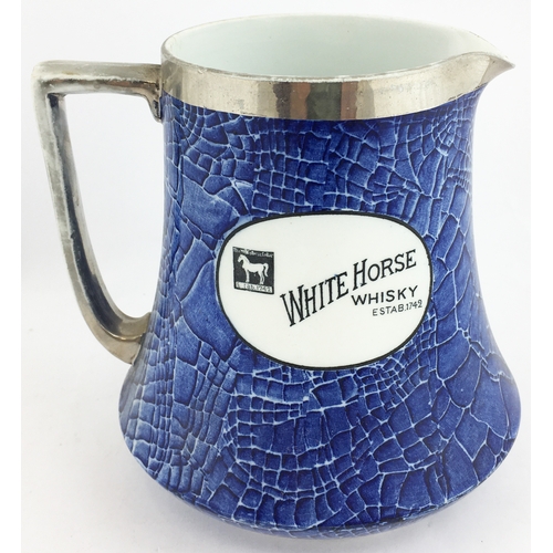 92 - WHITE HORSE WHISKY WATER JUG. 6.5 ins tall. Blue marbled overall body design with white oval panels ... 