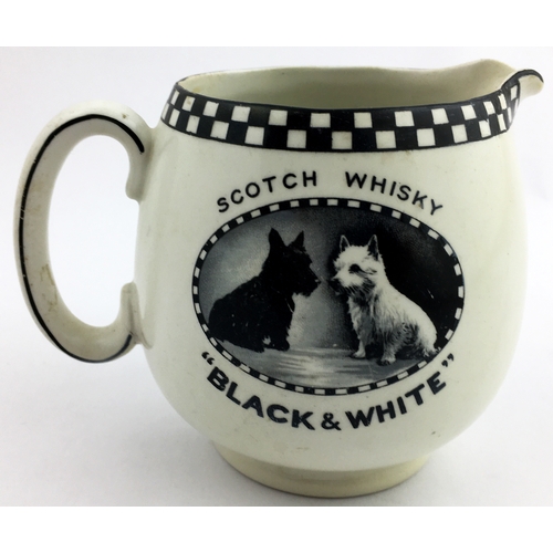 194 - BLACK & WHITE SCOTCH WHISKY JUG. 4.3 ins tall. Familiar chequerboard rim with two Scottie dogs pict.... 