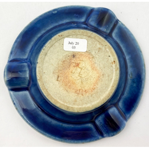 209 - OXFORD THE MITRE ASHTRAY.  4.5 ins diam. Deep blue stoneware with raised crown to  centre, letters t... 
