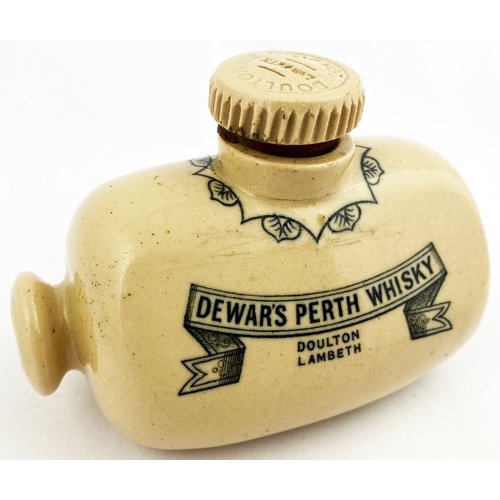 105 - DEWARS PERTH WHISKY MINIATURE SAMPLE FOOTWARMER - MUFF HELD WHISKY JUG. (WG p56) 4.25ins tall. Black... 