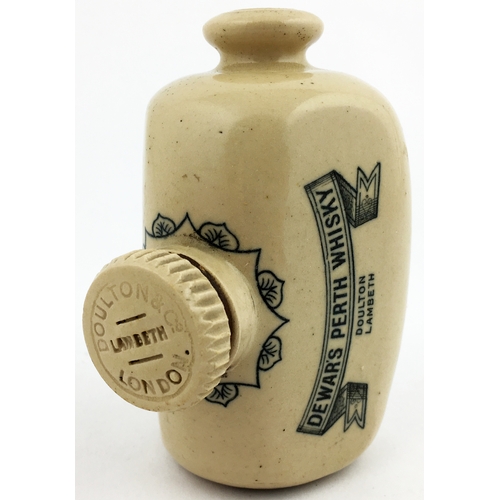 105 - DEWARS PERTH WHISKY MINIATURE SAMPLE FOOTWARMER - MUFF HELD WHISKY JUG. (WG p56) 4.25ins tall. Black... 