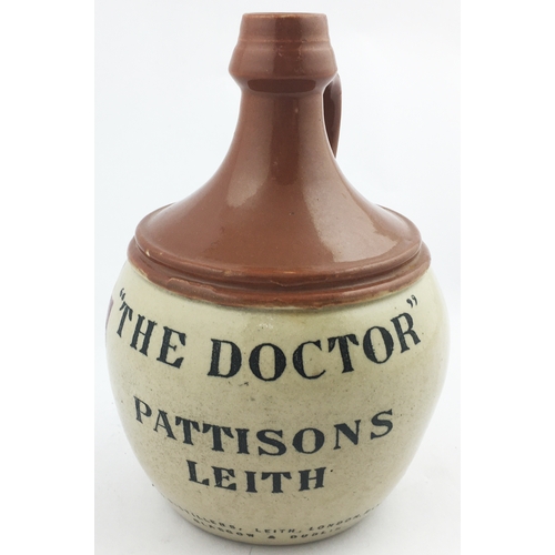 114 - LEITH WHISKY JUG. (WG B492) 7ins tall, t.t., handled. Red brown top, lower off white. Black transfer... 