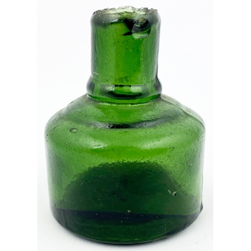 280 - CIRCULAR INK BOTTLE. 2.5ins tall. Dark green glass (delightful crude body texture), sheared lip, X e... 