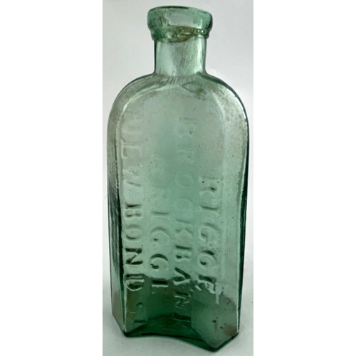 29 - RIGGE EMBOSSED EARLY MEDICINE BOTTLE. 6ins tall, aqua glass, tooled band lip, arched shoulders with ... 