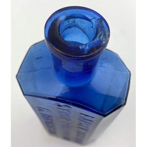 30 - G. HANDYSIDE SYRUP BOTTLE. 6.5ins tall. Bright blue glass, rectangular body, chamfered corners. Fron... 