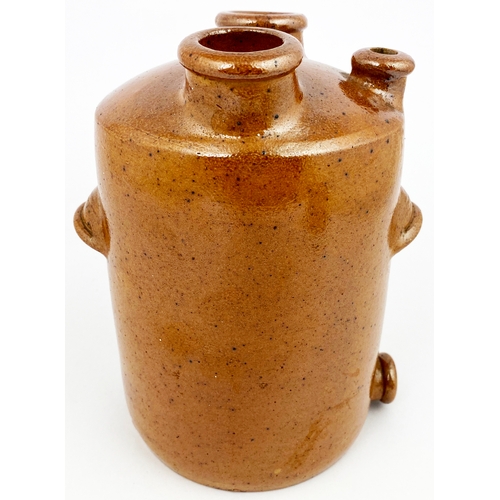 317 - UNUSUAL STIFF MADE JAR. 7ins tall. Mid brown speckled salt glaze. Three protruding funnels to top, s... 