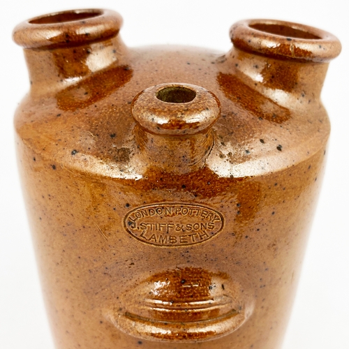 317 - UNUSUAL STIFF MADE JAR. 7ins tall. Mid brown speckled salt glaze. Three protruding funnels to top, s... 