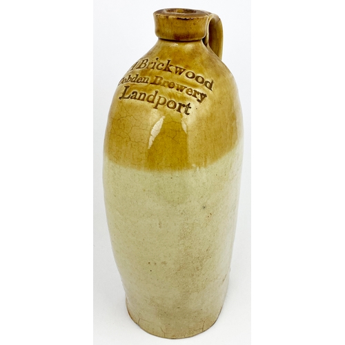 319 - LANDPORT FLAGON. 12ins tall, t.t. Bristol type glaze. Shoulder impressed H BRICKWOOD/ COBDEN BREWERY... 