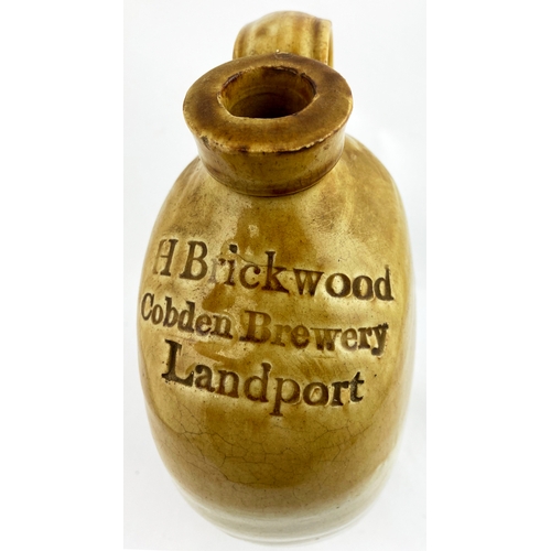 319 - LANDPORT FLAGON. 12ins tall, t.t. Bristol type glaze. Shoulder impressed H BRICKWOOD/ COBDEN BREWERY... 