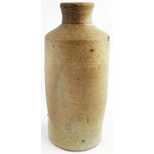 320 - WARRENS CHARING CROFS BLACKING BOTTLE. 7ins tall. Green/ grey slip glaze, impressed WARRENS/ LIQUID ... 