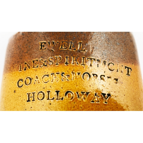 322 - HOLLOWAY HIP FLASK. 7ins tall, t.t., scalloped detail around neck area. Front impressed E WELL/ WINE... 