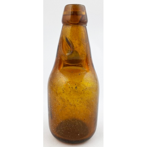 326 - DUMPY CODDS PATENT BOTTLE. 7.5ins tall. Mid brown glass, 2 neck retaining lugs. Embossed CODDS PATEN... 