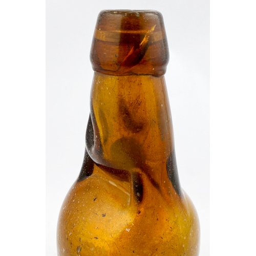 326 - DUMPY CODDS PATENT BOTTLE. 7.5ins tall. Mid brown glass, 2 neck retaining lugs. Embossed CODDS PATEN... 