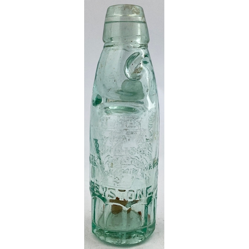 329 - KEYSTONE CODD BOTTLE. 7.5ins tall. Aqua glass, 10 sided base, 2 neck retaining lugs. Heavily embosse... 