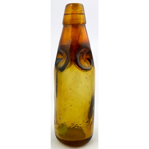 330 - LEIGH & CO PREMIER CODD BOTTLE. 8.5ins tall. Golden amber glass, 4 neck retaining lugs. Embossed LEI... 