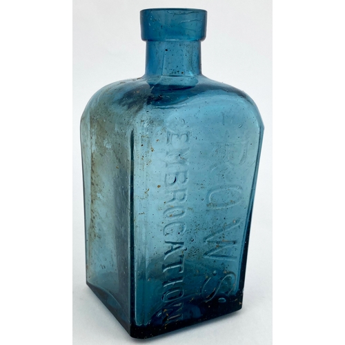 34 - ROWS EMBROCATION BOTTLE. 5.25ins tall. Ice blue glass, square body, rounded shoulders, cross hinged.... 