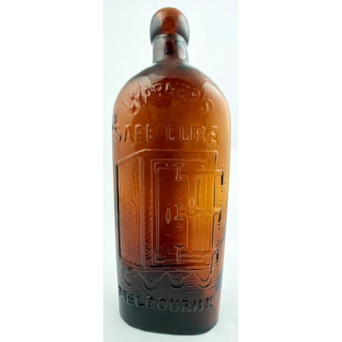 37 - WARNERS SAFE CURE MELBOURNE BOTTLE. 9.5ins tall. One pint, red amber glass, sloping shoulders, short... 