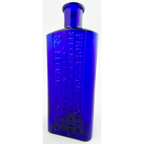 46 - ST LEONARDS- ON- SEA HAIR RESTORER BOTTLE. 6ins tall. Cobalt blue glass. Rectangular shape, rounded ... 