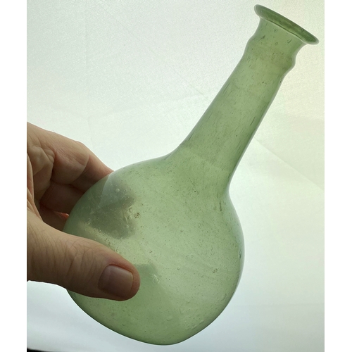 70 - FREEBLOWN PHIAL TYPE BOTTLE. 6.75ins tall. Light greeny/ aqua. Long crude neck, thin rolled lip & eq... 