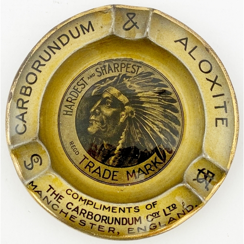 20 - MANCHESTER CARBORUNDUM & ALOXITE ASHTRAY. 5ins diam. Beautiful Indian head to centre, gold band to o... 