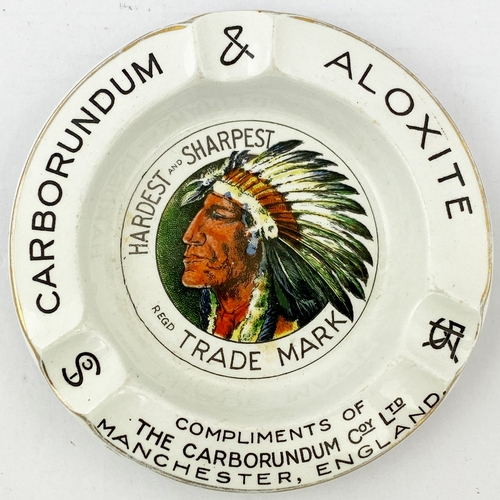 21 - MANCHESTER CARBORUNDUM & ALOXITE ASHTRAY. 5ins diam. Again Indian head detail to centre, gold band t... 