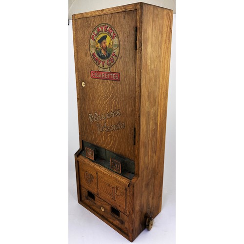 23 - PLAYERS NAVY CUT DUAL CIGARETTE MACHINE. 26ins tall, 6.5ins wide, 10.5ins length. Wooden machine wit... 