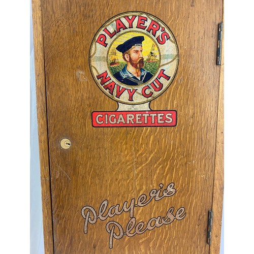 23 - PLAYERS NAVY CUT DUAL CIGARETTE MACHINE. 26ins tall, 6.5ins wide, 10.5ins length. Wooden machine wit... 