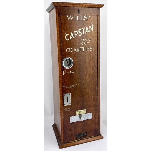 24 - WILLS CAPSTAN NAVY CUT CIGARETTE MACHINE. 23ins tall, 7ins wide, 8.25ins length. Wooden machine with... 